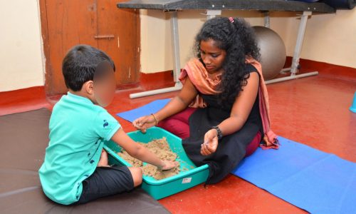 Trainers helping children